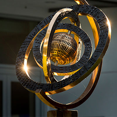 globe-400x400 a brass globe statue part of the art on display in Freeman's GWBC.